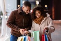 Portrait,Of,Lovely,Black,Couple,Holding,Many,Colorful,Shopping,Bags,